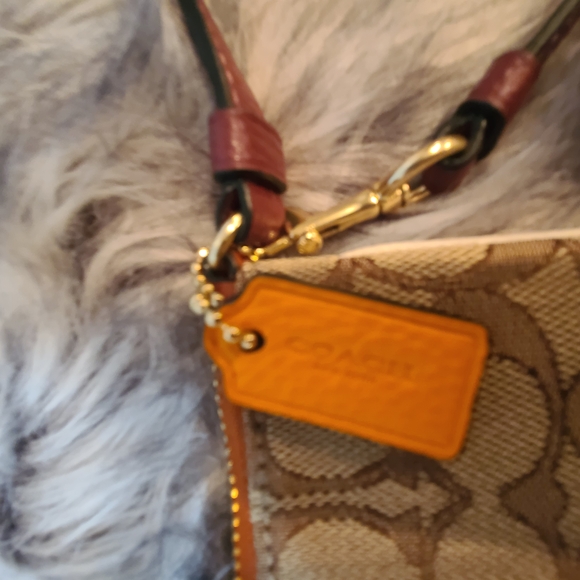 Coach Signature Leather Dempsey Tan and Orange Wristlet. - Picture 3 of 6